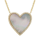 Heart-shaped mother-of-pearl pendant framed with diamonds on a gold chain by our jewelry brand