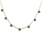 Elegant gold necklace with blue gemstone pendants from our luxury jewelry collection.