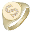 Gold ring with diamond-encrusted S emblem, personalized jewelry by our brand.