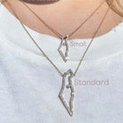 14K Gold Diamond Outline Necklaces representing the Land of Israel in small and standard sizes, worn on a model's neck.