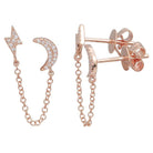 Rose gold moon and lightning bolt earrings with diamond accents and chain design by our luxury jewelry brand.