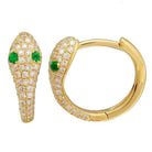 Gold snake-shaped earrings with emerald eyes and diamond accents from our exclusive jewelry collection.