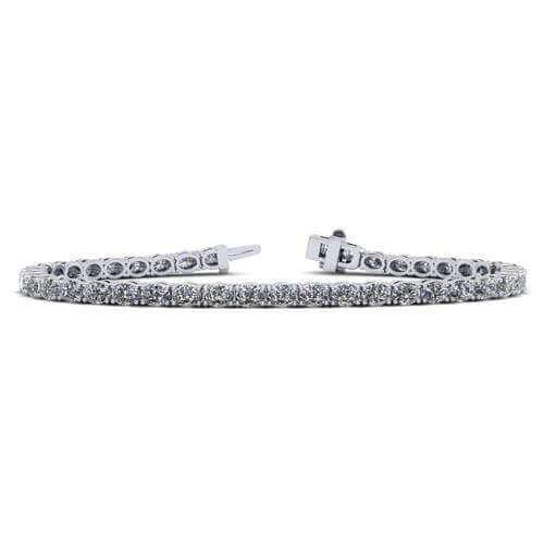 Elegant diamond tennis bracelet in white gold by our jewelry brand, featuring sparkling round-cut diamonds for a timeless, luxurious look.