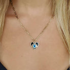 Elegant heart-shaped pendant with blue eye on gold chain necklace from our exclusive jewelry collection.