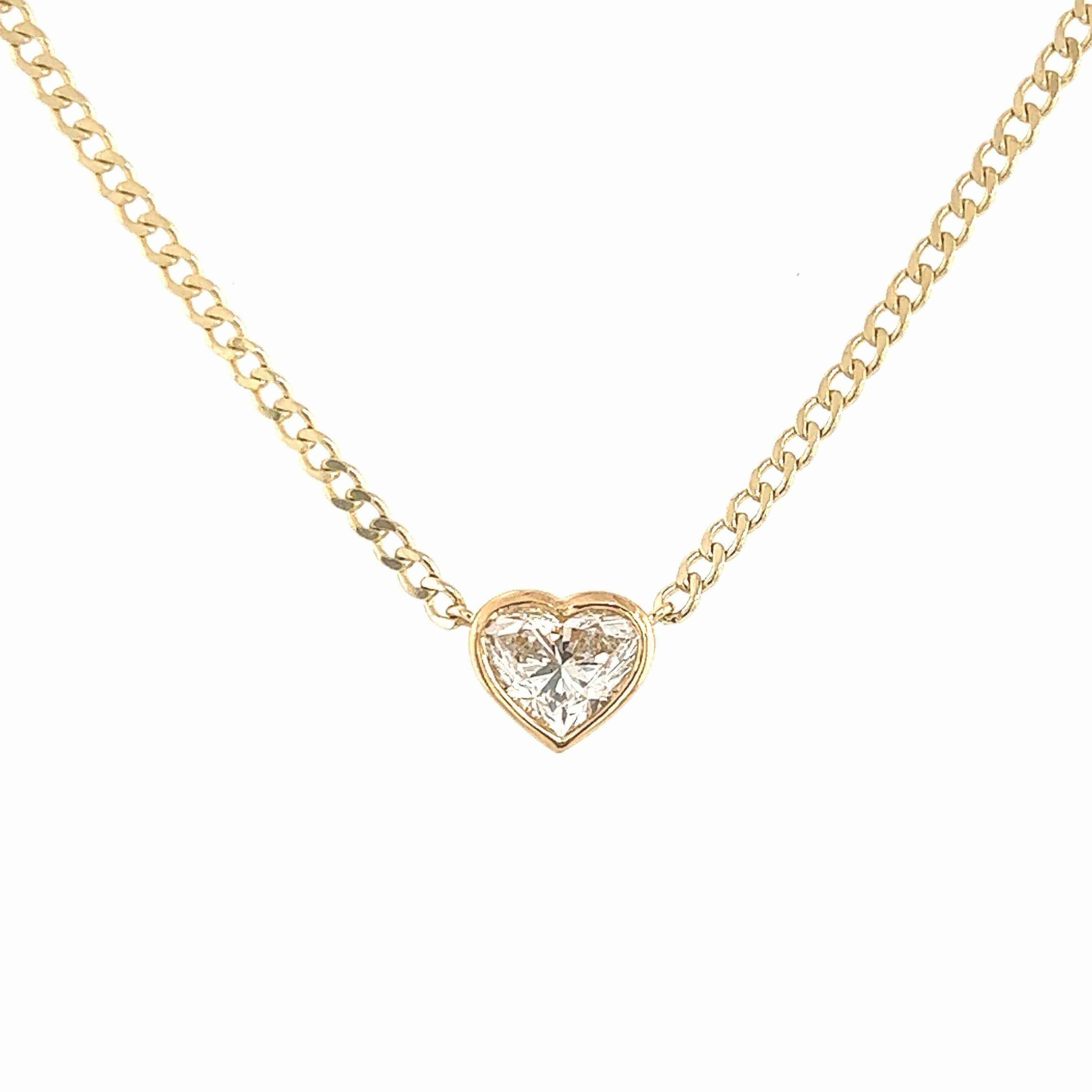 Heart-shaped diamond pendant on a gold chain necklace from luxury jewelry brand