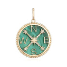 Gold compass pendant with green gemstone and diamond accents from our luxury jewelry collection.