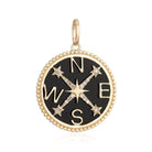 Gold compass pendant with diamond accents on black enamel by our jewelry brand