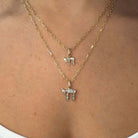 Hebrew Chai Baguette Diamond Necklace Charm displayed in 14K gold with baguette diamonds from Izakov Fine Jewelry.