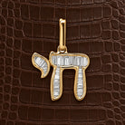 Hebrew Chai Baguette Diamond Necklace Charm in 14K yellow gold, styled, Izakov Fine Jewelry