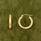 Tube Gold Hoop Earrings in 14K yellow gold, styled, Izakov Fine Jewelry