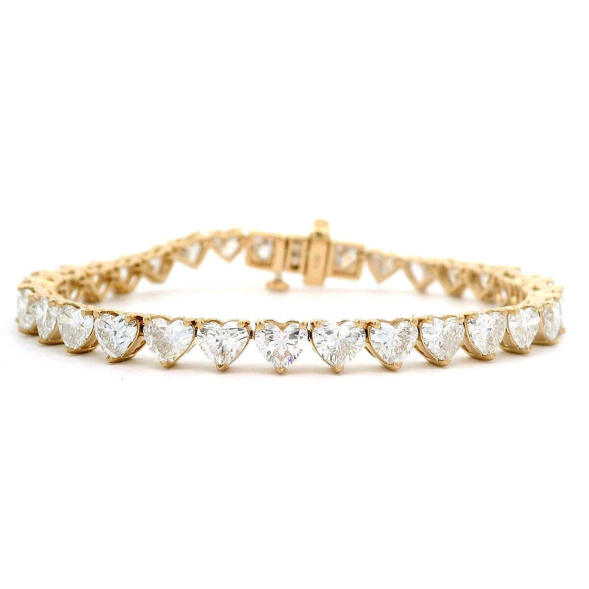 14K gold tennis bracelet featuring lab-grown heart-shaped diamonds, a luxurious and ethical jewelry piece.