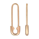 Gold safety pin shaped earrings from our jewelry collection. Simple and elegant design perfect for any occasion.