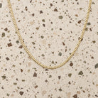 Micro Cuban Link Gold Chain Necklace in 14K yellow gold, styled, Izakov Fine Jewelry
