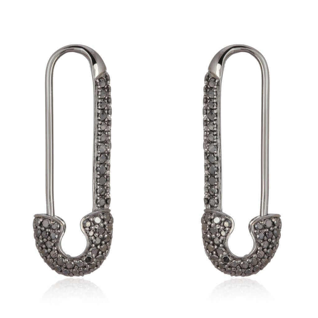 Sparkling safety pin-style earrings with dark stones from our jewelry brand collection.