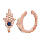 Rose gold hamsa earrings with blue center stone and diamond accents from our premium jewelry collection.