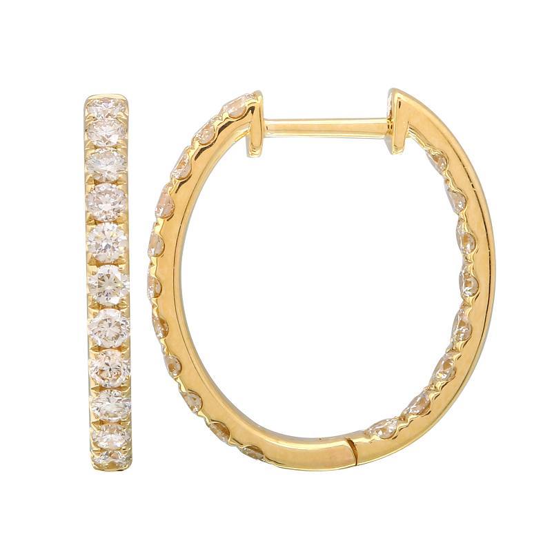 Gold hoop earrings with embedded diamonds showcasing our luxury jewelry brand.