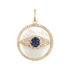 Luxurious gold pendant with mother-of-pearl inlay and blue sapphire eye design, elegantly crafted by our jewelry brand