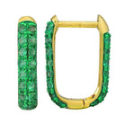 Elegant gold hoop earrings adorned with green gemstones, perfect for a sophisticated look