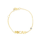 14K gold personalized baby bracelet with name "Micah" and birthstone charm, perfect for unique baby jewelry.