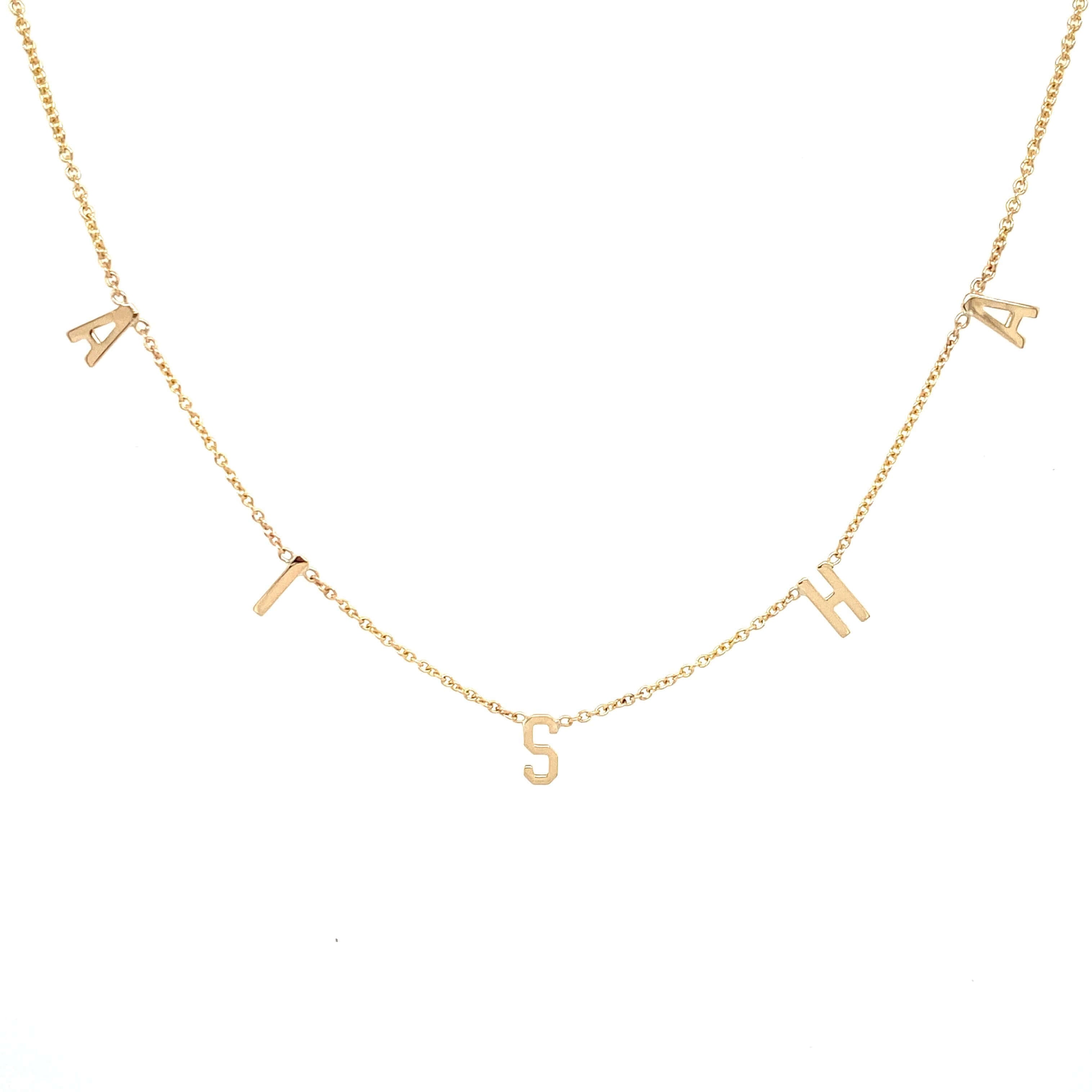 Gold letter necklace spelling "ATISHA" from our personalized jewelry collection