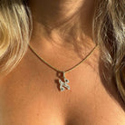 Personalized Charms Hebrew Gemstone Initial Pendant © featuring an elegant initial charm on a gold chain.