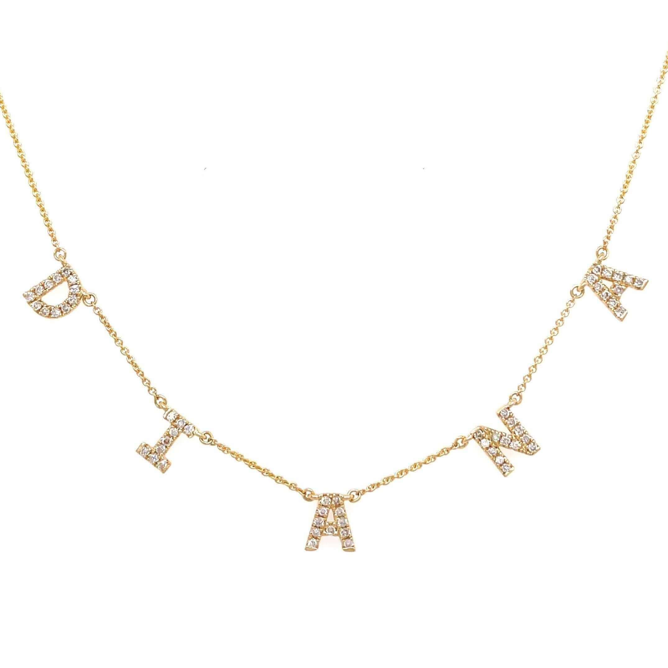 Gold necklace with diamond-studded custom letter charms in a delicate chain from our luxury jewelry collection.