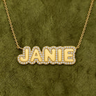 Personalized Diamond Cloud Nameplate Necklace in 14K yellow gold, styled, Izakov Fine Jewelry