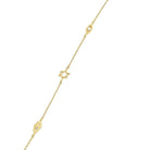 Delicate gold bracelet with unique charms from our exclusive jewelry collection.