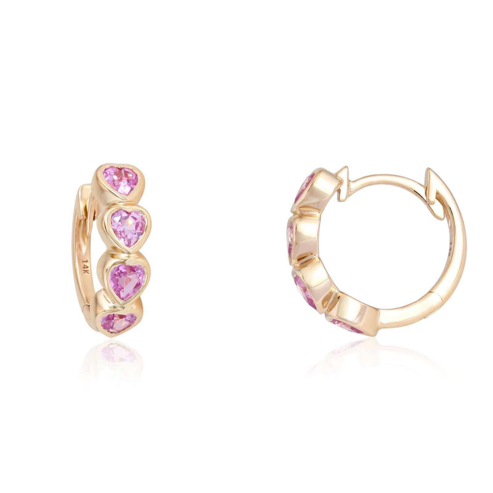 14k gold hoop earrings with heart-shaped pink gemstones from our exclusive jewelry collection. Perfect for adding a touch of elegance.