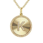 Gold necklace with diamond-encrusted letter K pendant, stylish jewelry from our exclusive collection.