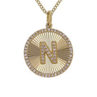 Gold initial "N" pendant necklace adorned with sparkling diamonds by [Your Jewelry Brand]