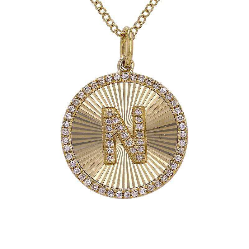 Gold initial "N" pendant necklace adorned with sparkling diamonds by [Your Jewelry Brand]