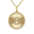 Gold pendant necklace with diamond-encrusted initial "S" for jewelry brand