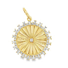 14K gold medallion necklace charm with radiating round and baguette diamonds, fluted design, and center diamond totaling 0.54 carats.