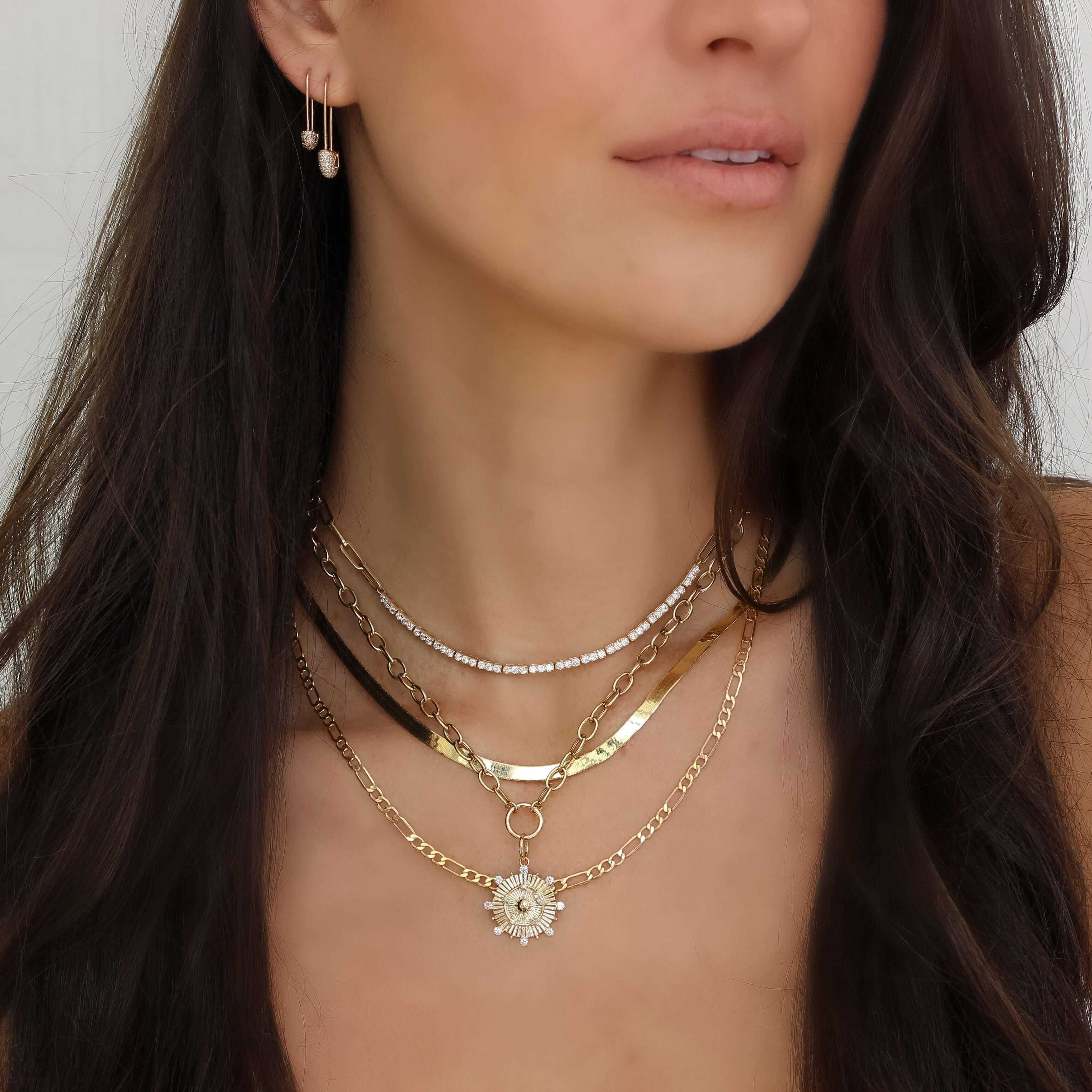 Model wearing layered gold necklaces from our jewelry brand showcasing elegance and style