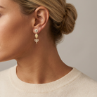 Round Diamond and Sapphire Evil Eye Menorah and Hamsa Earrings — model shot