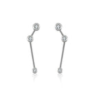 Modern silver drop earrings with sparkling diamonds from our exclusive jewelry collection.