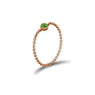 Rose gold chain ring with green gemstone from our exclusive jewelry collection.