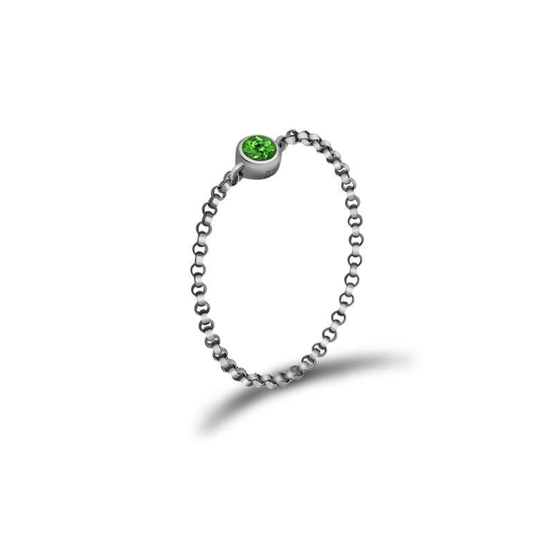 Elegant silver chain ring with a vibrant green gemstone from our luxury jewelry collection.