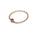 18K gold chain ring featuring a purple birthstone, elegant and timeless jewelry accessory for personal gifting.