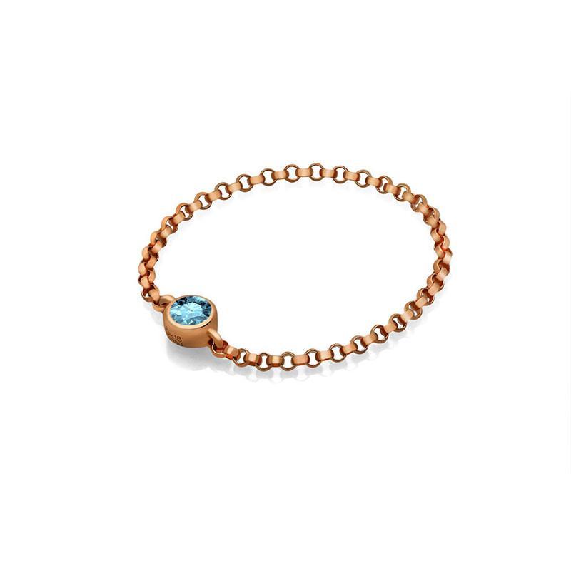 18K gold chain ring featuring a blue birthstone, elegant and meaningful jewelry accessory.