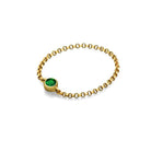 18K gold chain ring with green birthstone, elegant and meaningful jewelry piece for personal celebrations.