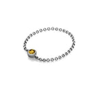 18K gold birthstone chain ring featuring a yellow gemstone, perfect for elegant fashion and meaningful gifts.