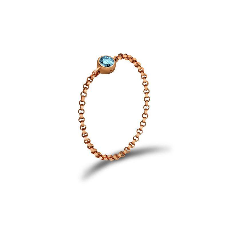 18K gold chain ring with a blue birthstone, perfect for personal significance and elegant jewelry collections.