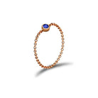 18K gold chain ring featuring a stunning blue birthstone, perfect for personal significance and elegant gifts.