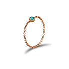 18K gold chain ring featuring a blue birthstone, elegant timeless accessory and meaningful gift.