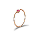 18K gold chain ring with pink birthstone, a timeless and elegant jewelry piece for personal significance and gifting.