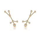 Gold constellation earrings featuring sparkling gemstones, elegant jewelry from our brand collection.