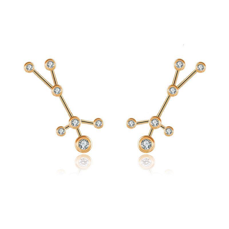 Gold constellation earrings featuring sparkling gemstones, elegant jewelry from our brand collection.