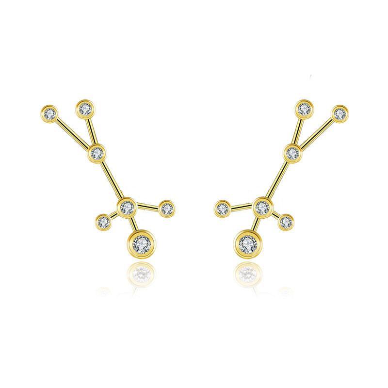 Gold constellation earrings with sparkling gemstones from our jewelry collection.